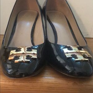 Tory Burch black patent stack heal pumps